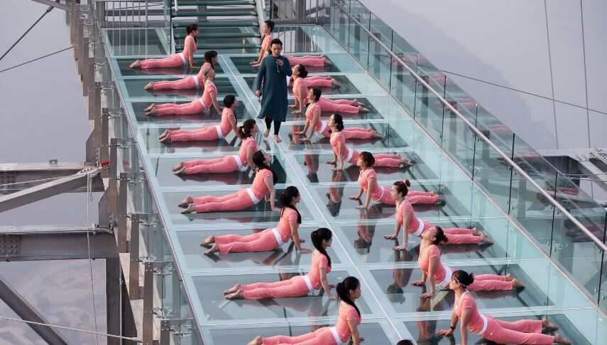 People practice yoga at a tourist spot ahead of the International Day of Yoga, on the outskirts of Beijing (Photo courtesy: Reuters)